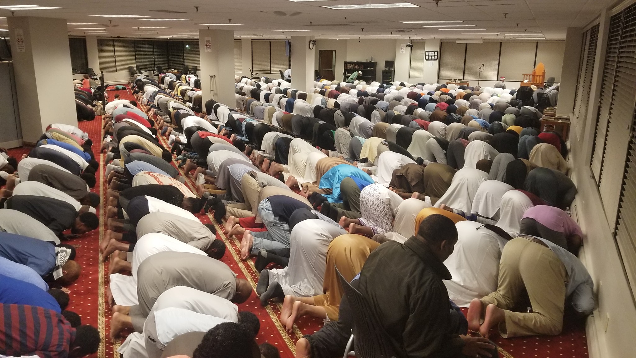 Al-Amaan Center congregation praying in the main prayer space in Minnetonka
