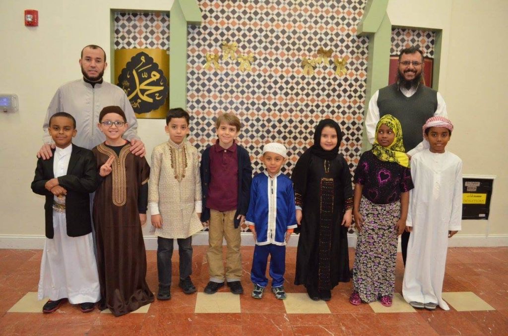 Al Huda Society children and teachers in the prayer and program space