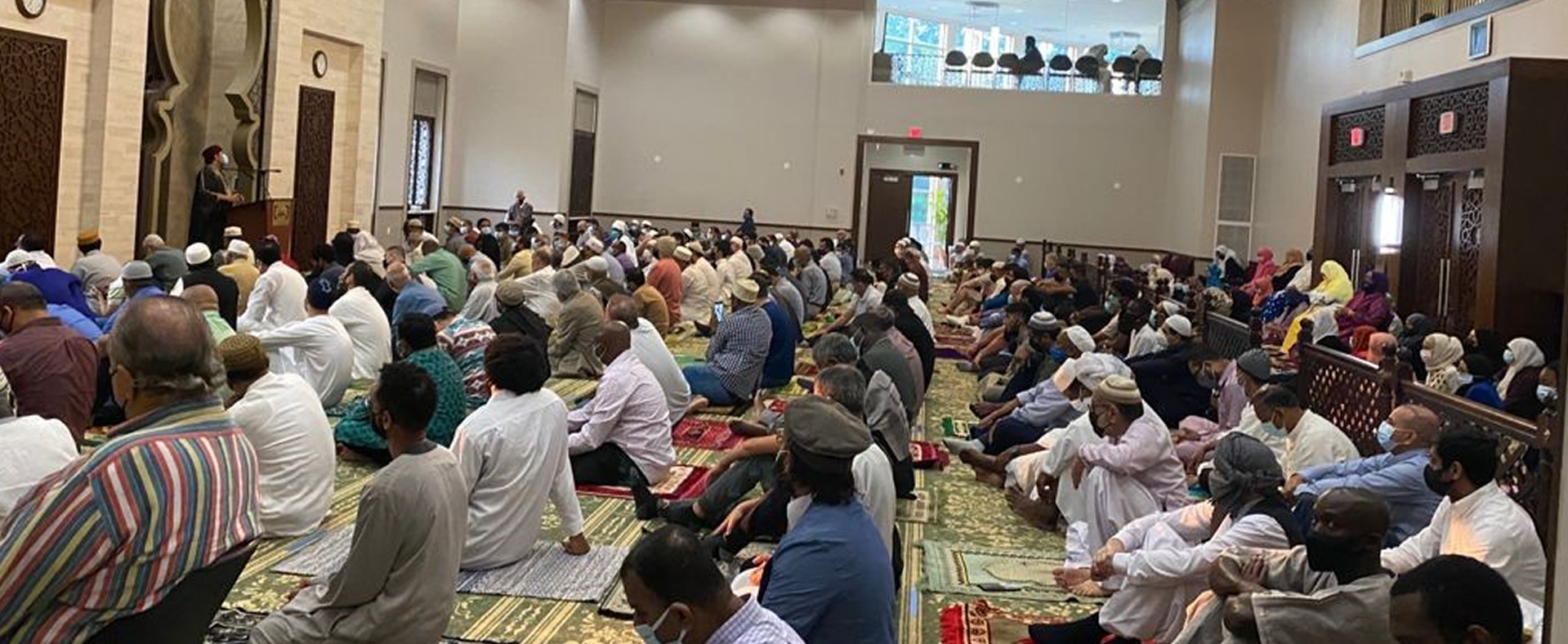 All Dulles Area Muslim Society ADAMS congregation seated for a lecture or prayer in the Sterling prayer hall