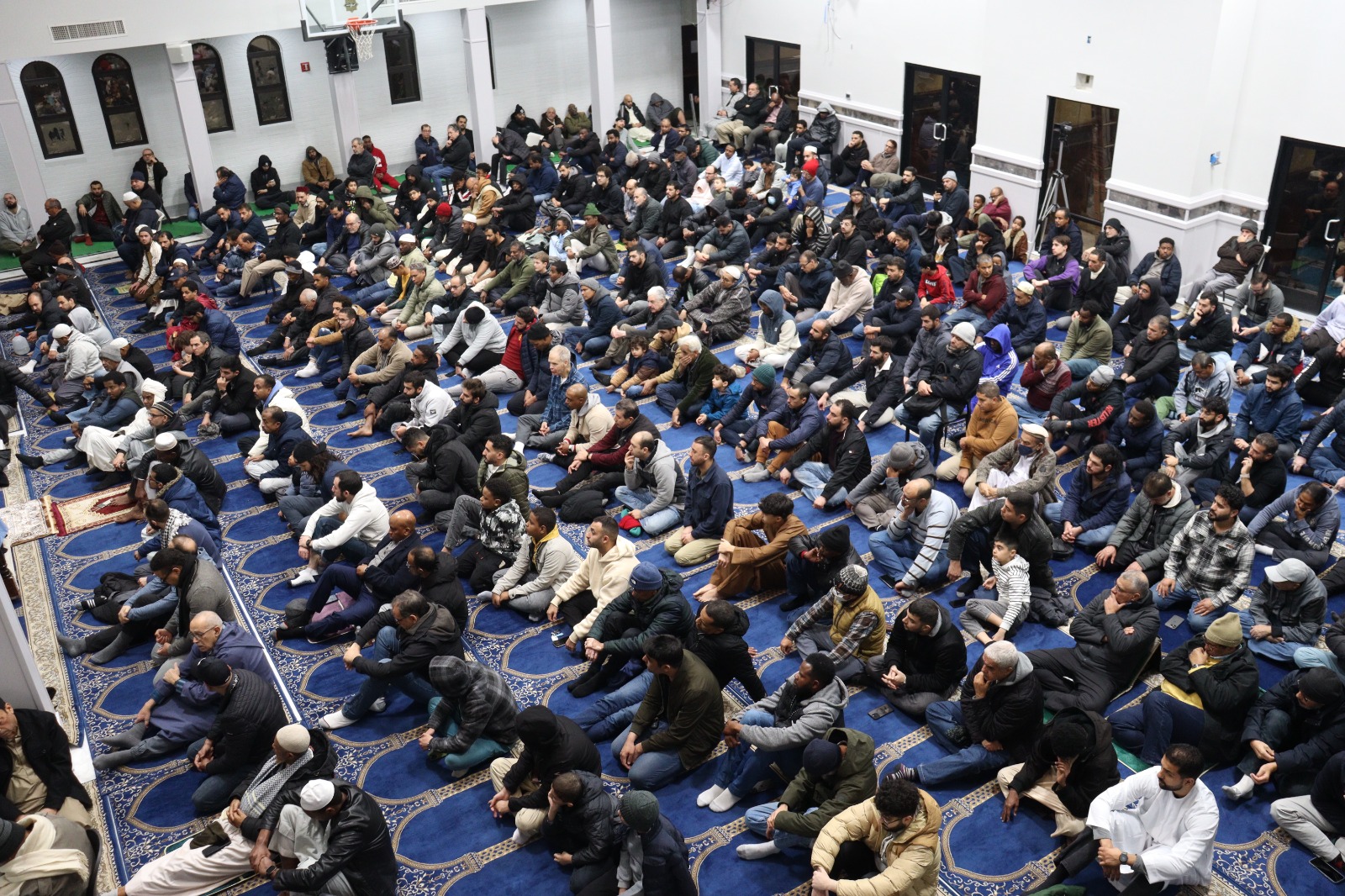 Dar Al Hijrah Islamic Center congregation seated in the Falls Church prayer hall