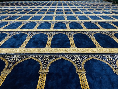 Prayer carpet rows inside Hamzah Islamic Center facility