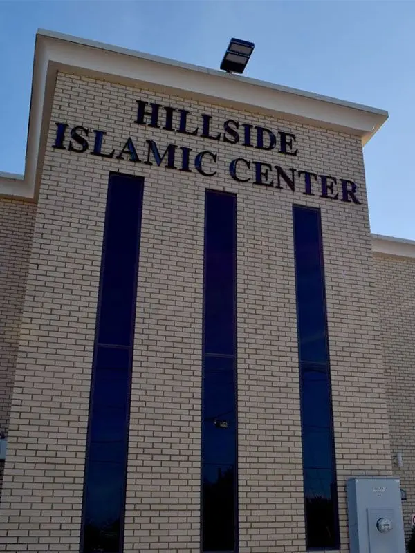 Exterior sign on the Hillside Islamic Center building in New Hyde Park, NY