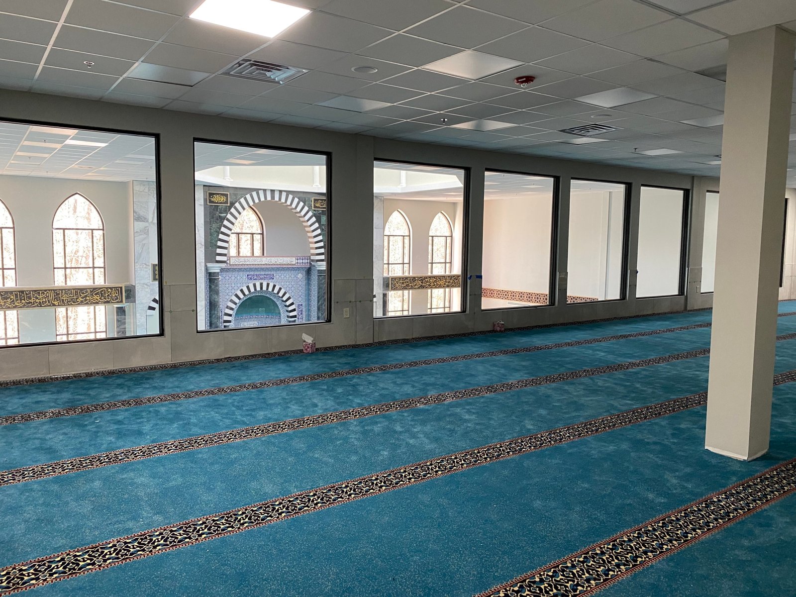 Islamic Association of Cary prayer hall with blue carpet and mihrab