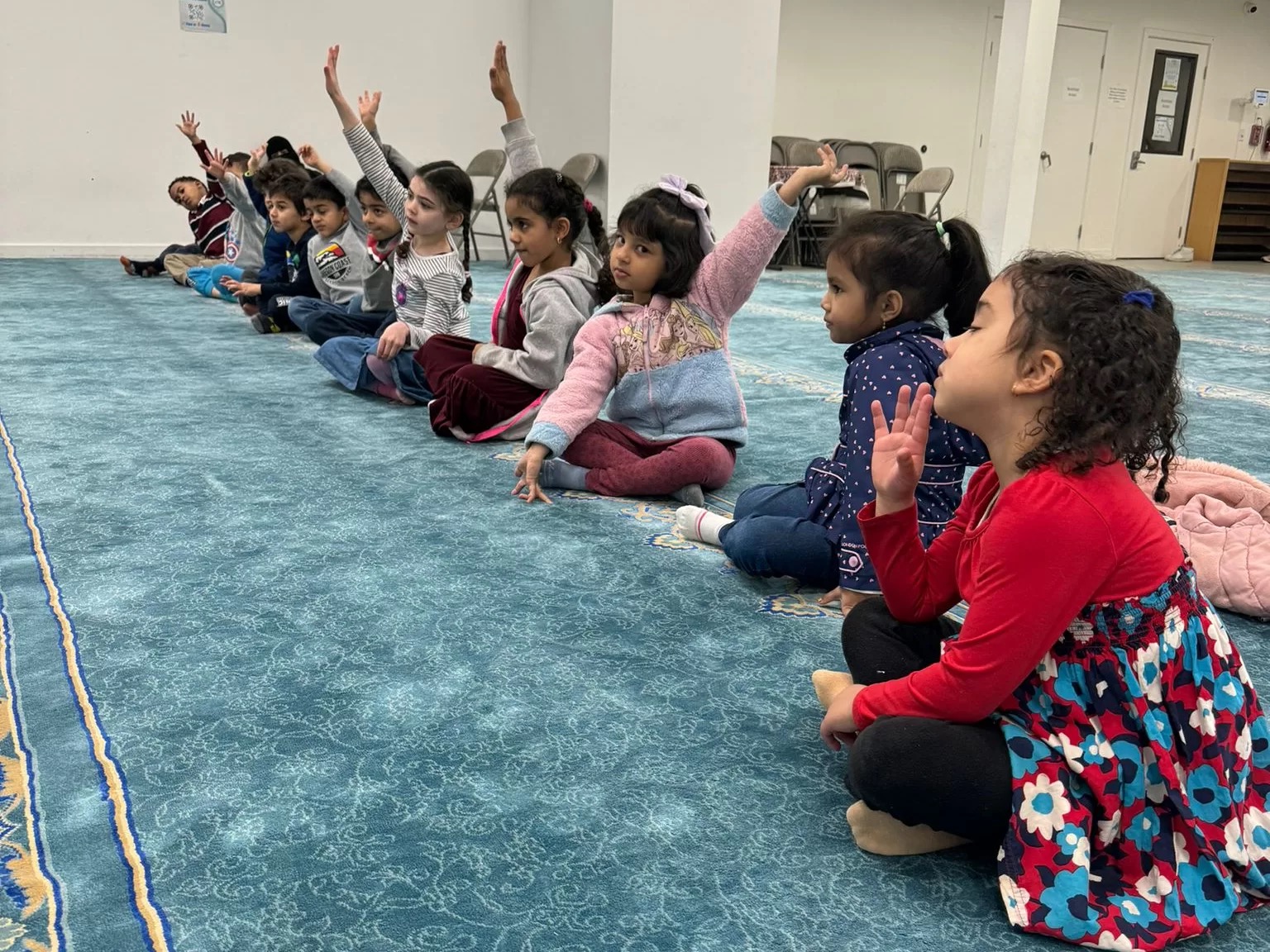 Children seated for an ArRowaad Academy or ICOB learning program at Islamic Center of Bothell