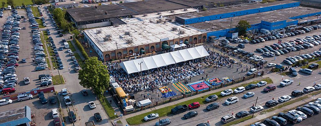 Aerial view of Islamic Center of Detroit campus during a large outdoor gathering in Detroit, MI