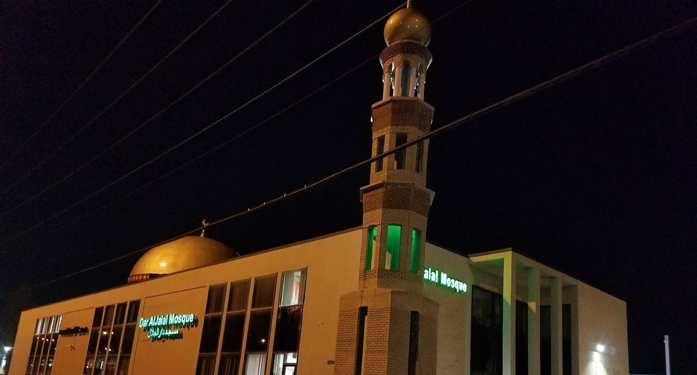 Dar Aljalal Masjid exterior illuminated at night in Hazelwood