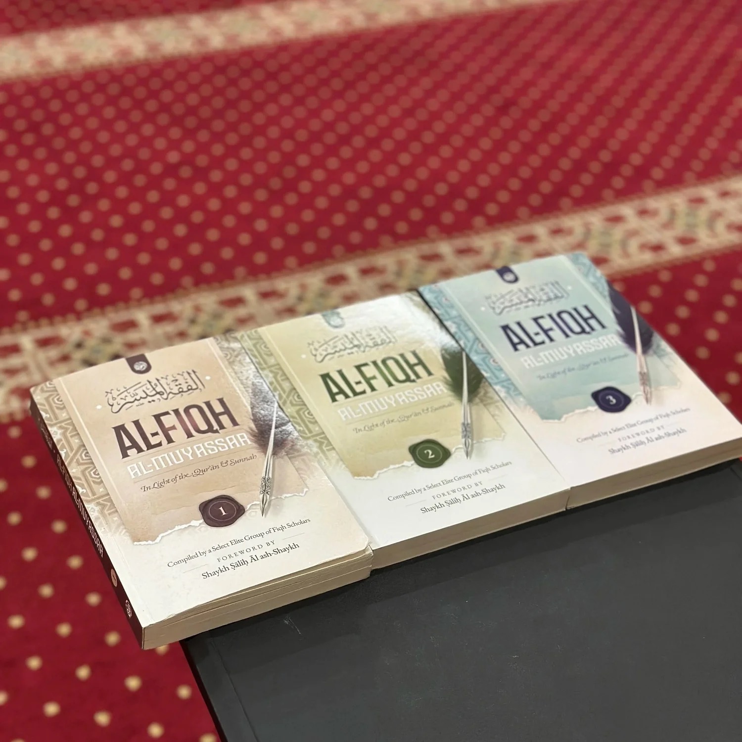 Islamic books displayed on the Islamic Center of Modesto prayer carpet