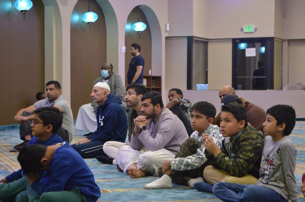 Community members seated in the musallah at Islamic Center of Owings Mills