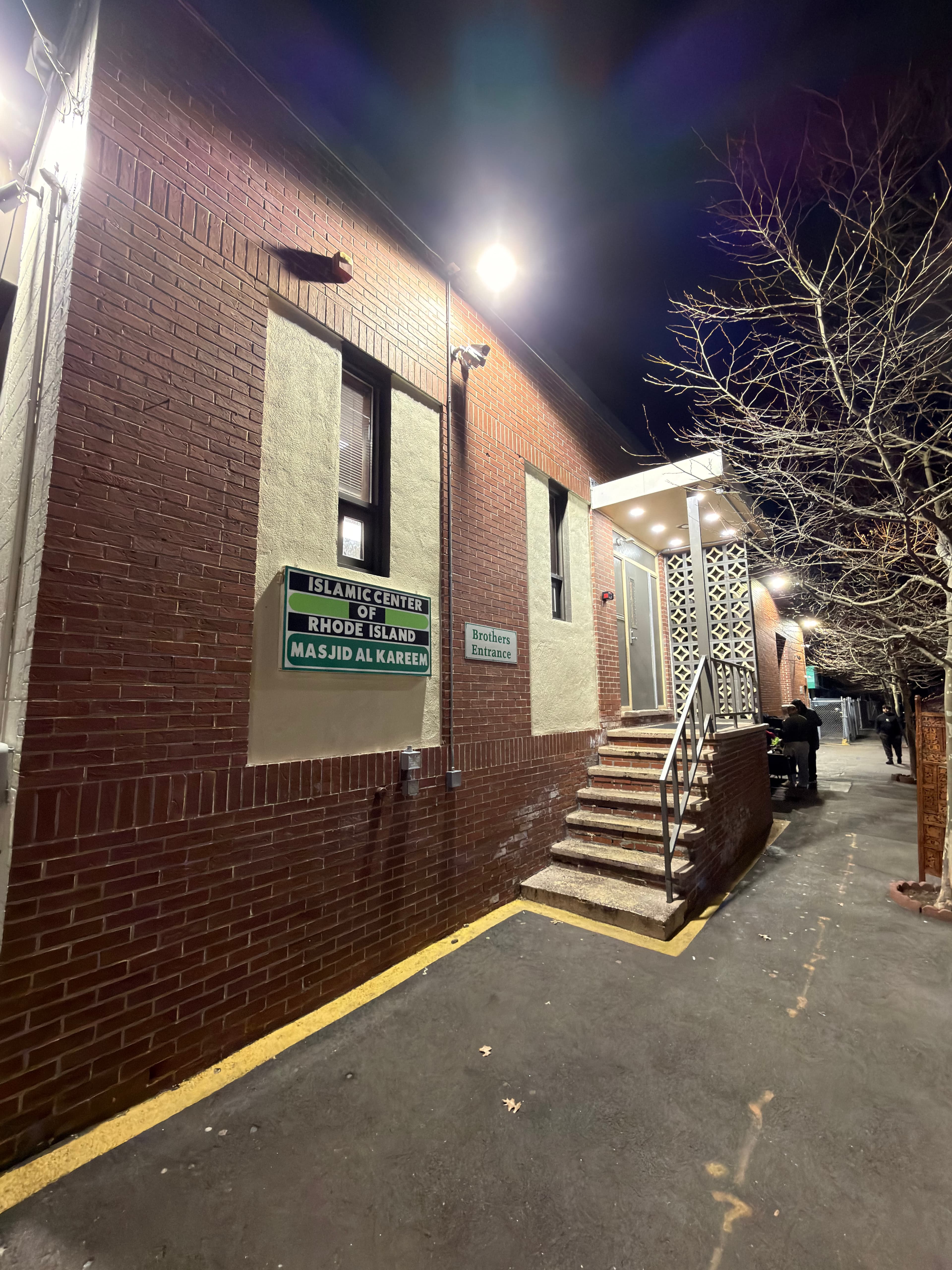 Islamic Center of Rhode Island Masjid Al Kareem exterior and entrance sign at night