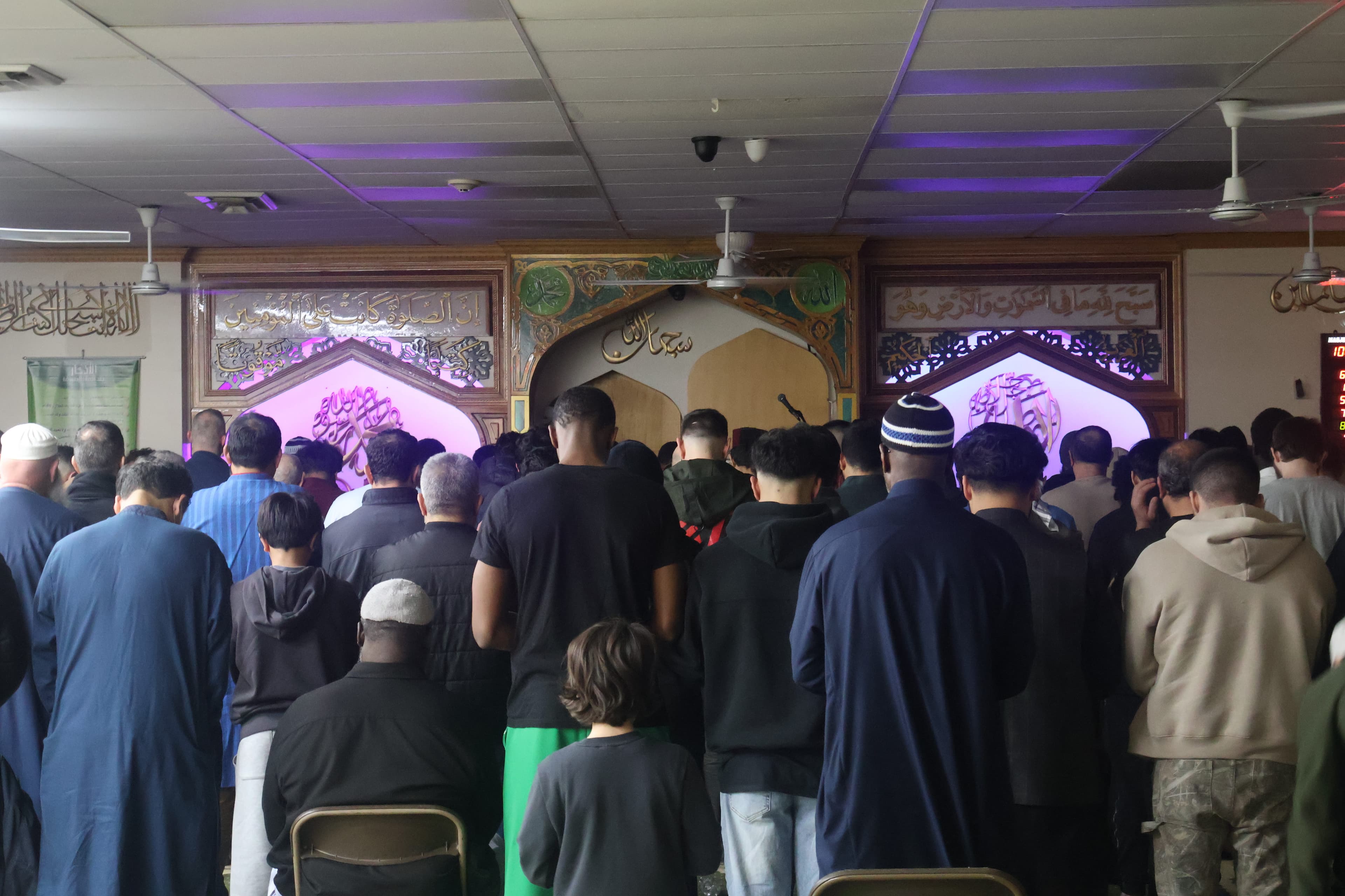 Masjid Al Kareem prayer hall with congregants praying