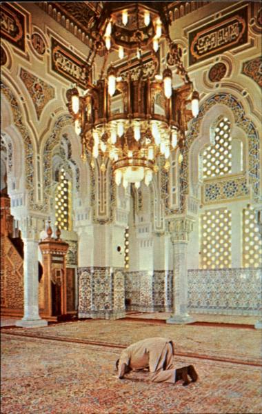 Historic Islamic Center of Washington DC interior with chandelier and worshipper