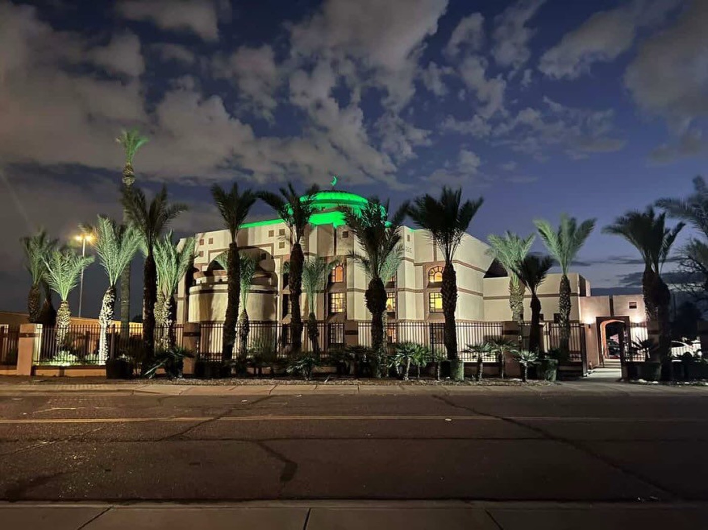 Islamic Community Center of Phoenix exterior lit at night with palm trees