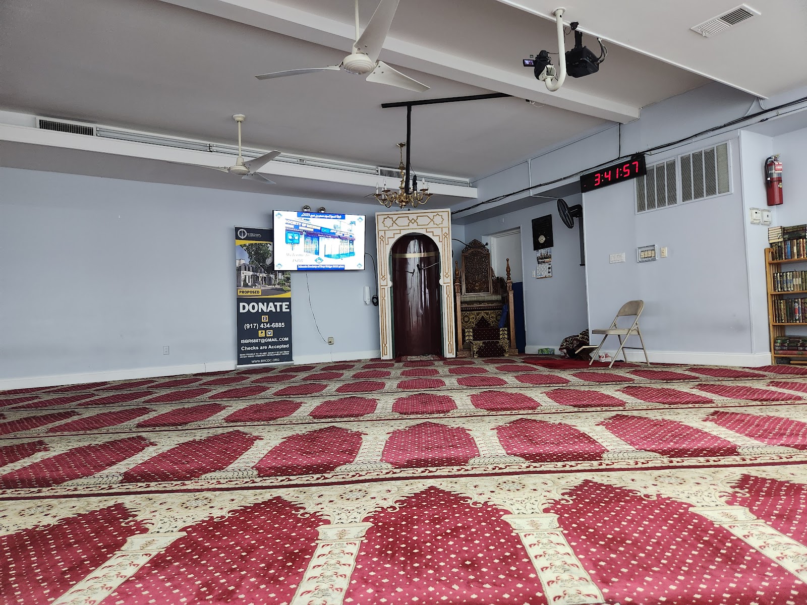 Islamic Society of Bay Ridge prayer hall with mihrab and prayer carpet rows