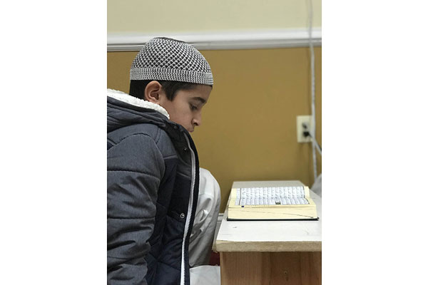 Student reading Quran in the Manassas Muslim Association Hifz program