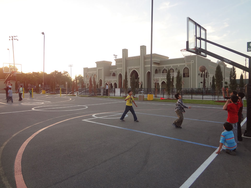 Children playing basketball outside Maryam Islamic Center in Sugar Land