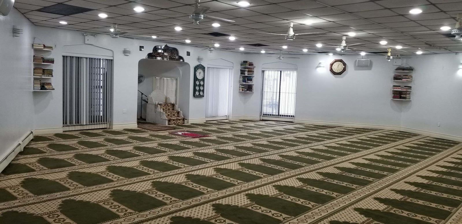 Masjid Alfalah interior prayer hall and mihrab area in Corona