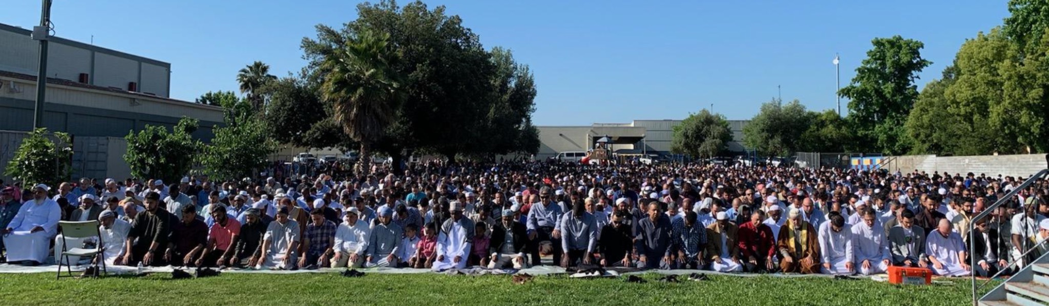 Large outdoor Eid prayer gathering at Masjid Annur Islamic Center
