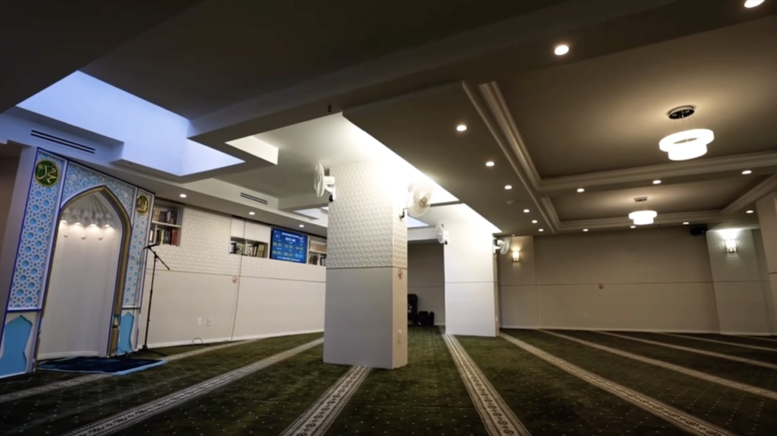 Islamic Center of Imam Abu Hanifa prayer hall interior with mihrab and prayer rows in Brooklyn