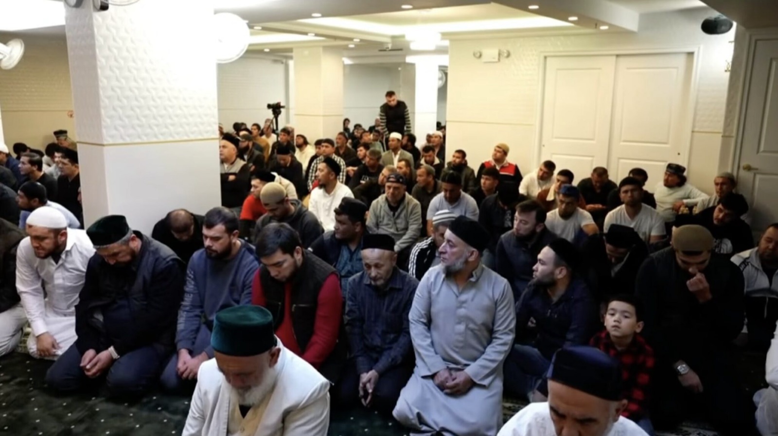 Congregation seated inside Islamic Center of Imam Abu Hanifa in Brooklyn
