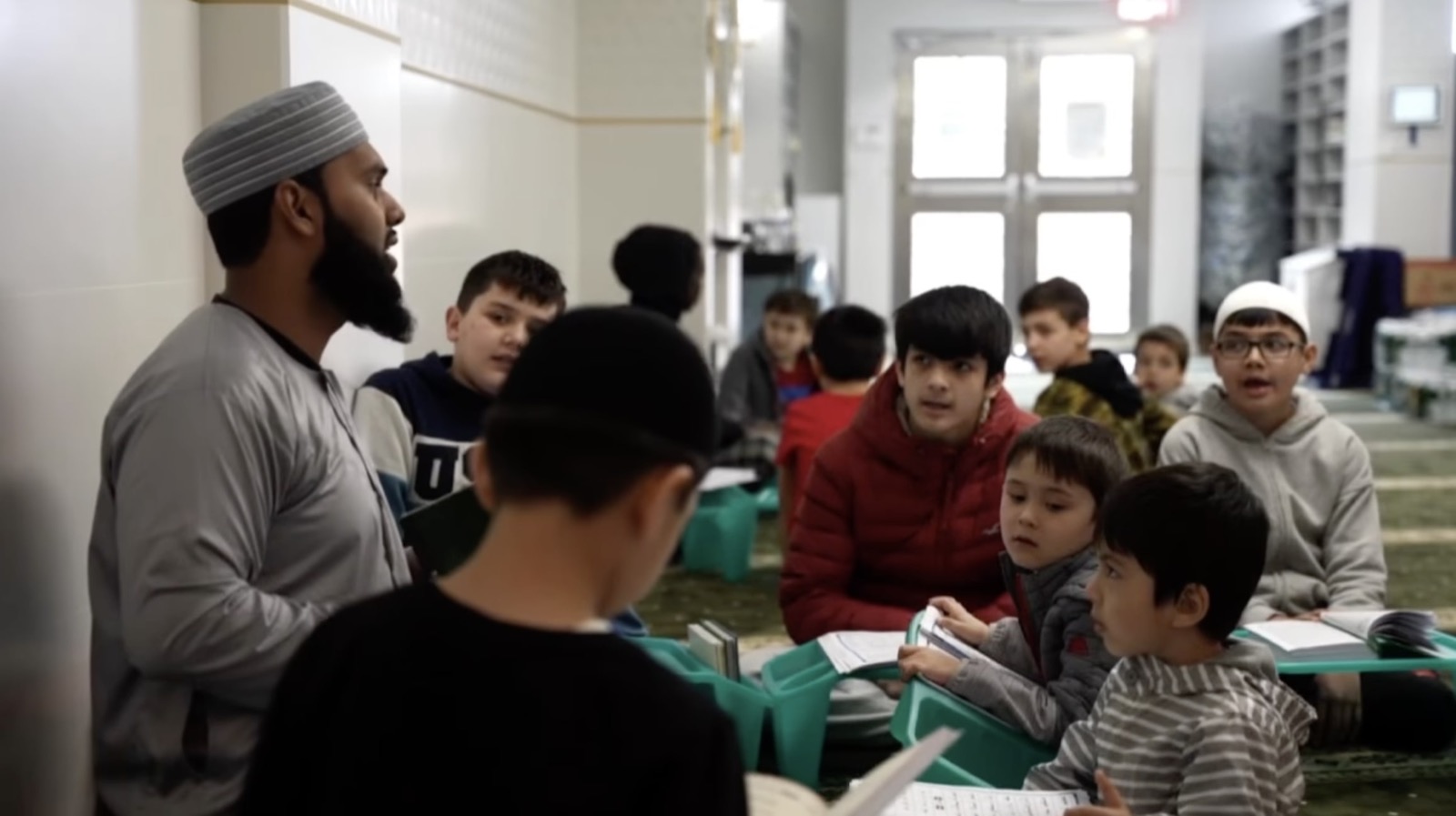 Children learning with a teacher inside Islamic Center of Imam Abu Hanifa