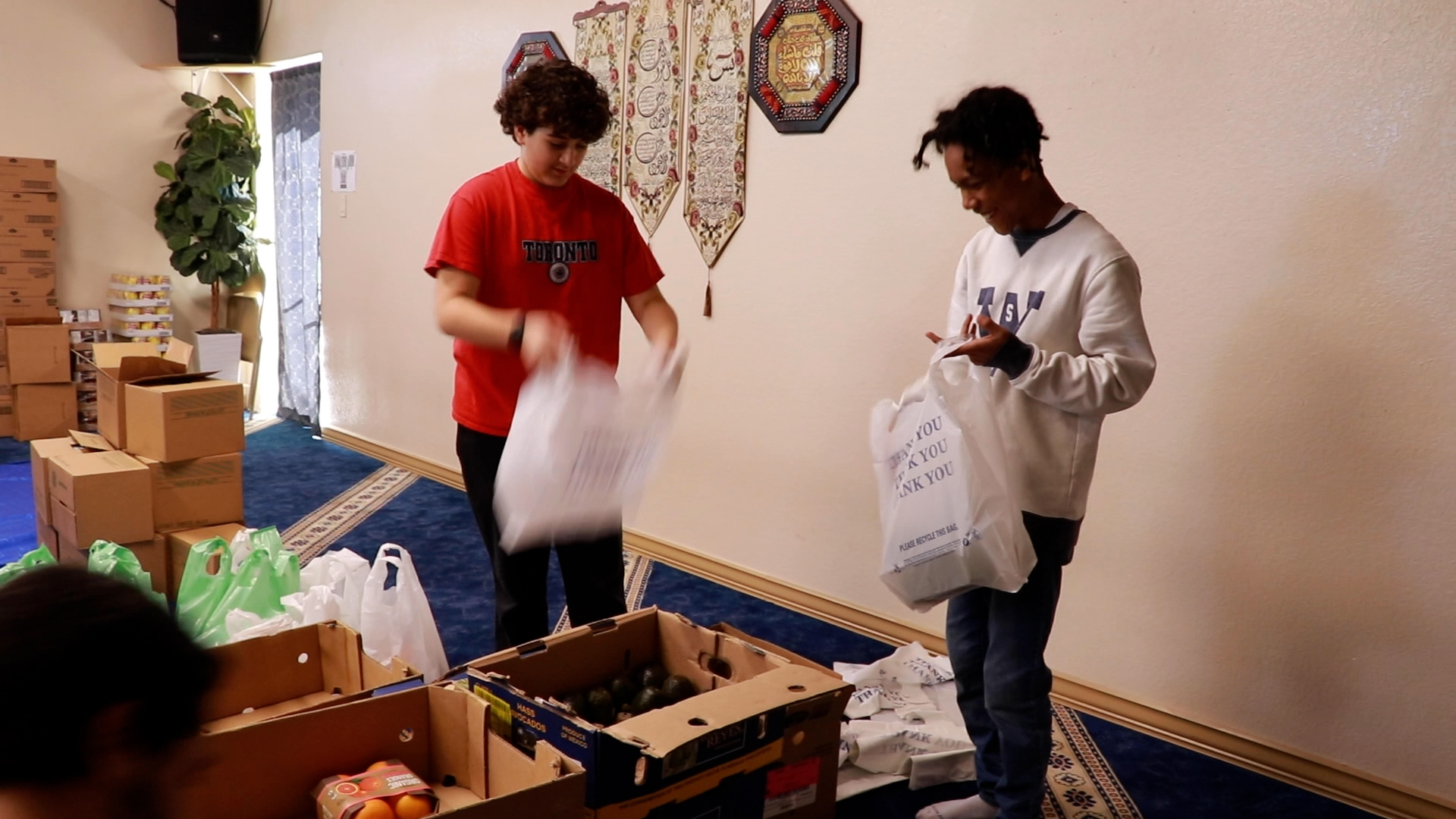 Food relief volunteers packing food at Downtown Denver Islamic Center