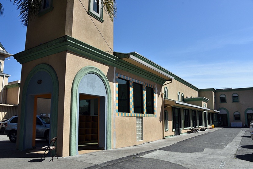 Exterior of Oakland Islamic Center with green-trimmed portico and mosque building on 31st Street